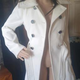 New n tagged I paid £21.. Cream lined coat tagged size 10 from atmosphere big collar big buttons patch pockets tie belt a small flaw flaw see photo 3 . .hidden anyway once the coat is done up but so tiny. Pet n smoke free home quite heavy. A free gift with this coat. See the other post for more photos of th3 buttons. Length is 21.5 inches.