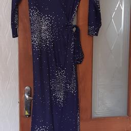 never been worn wrap dress,stretchy material,ideal for upto 5 foot 2 inches height,ordered xlarge size but is more 12 or medium size