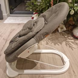 A rarely used Stokke bouncer. Its colour is deep grey (using the Stokke description) with white chassis.
It comes with an instruction manual. it doesn't include the toy hanger.