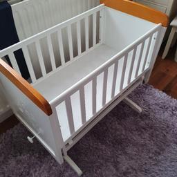 winnie the pooh wooden crib, great condition, also comes with 3.5cm thick matresss with mattress cover (brand new) and wedge pillow also in very good condition. none smoking Home.