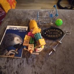 bundle of african grey parrot bits a book a cage plaque food feeder and toys collect only from battersea sw8 cash on collection only