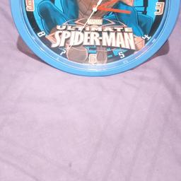 Spiderman wall clock in good working order. Few light scratches but no problems