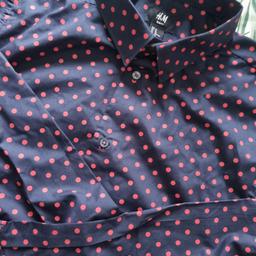 This new polkadot, long sleeved shirt would be an ideal addition to your wardrobe.