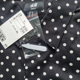 This New slim fit, polkadot, long sleeved shirt, would be an ideal addition to your wardrobe.