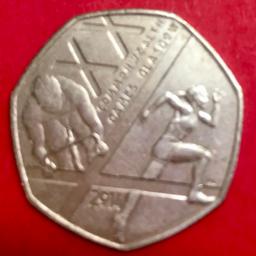 This 50p commemorates the 20th Commonwealth Games in Glasgow in 2014. The design features a depiction of a sprinter and a cyclist alongside the St Andrew's Cross.
Athletics and cycling were two of the 17 different sports featured in the Games over 11 days.

Circulated coin, in reasonable condition. (I have 2 x available listed separately, this is coin 1-please ask if you’d like both).