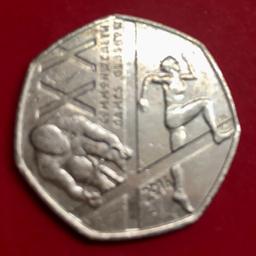 This 50p commemorates the 20th Commonwealth Games in Glasgow in 2014. The design features a depiction of a sprinter and a cyclist alongside the St Andrew's Cross.
Athletics and cycling were two of the 17 different sports featured in the Games over 11 days.

Circulated coin, in reasonable condition. (I have 2 x available listed separately, this is coin 2-please ask if you’d like both).