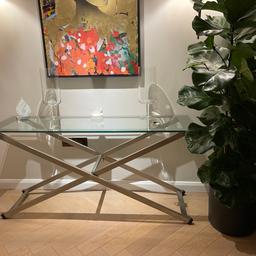 Like new
Beautiful stunning cross leg metal console table with glass top .