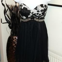 beautiful quiz black party dress 
size 8 but would fit upto a 10-12 as it has an elasticated back
collection only from B63 Halesowen area