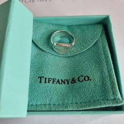 In good preloved condition and retired Tiffany&Co. Tiffany RTT oval signet ring. Size 5 1/4 - UK K. Pouch and box. Trusted seller, UK based. See my profile for a large variety of T&Co. items. Thank you.