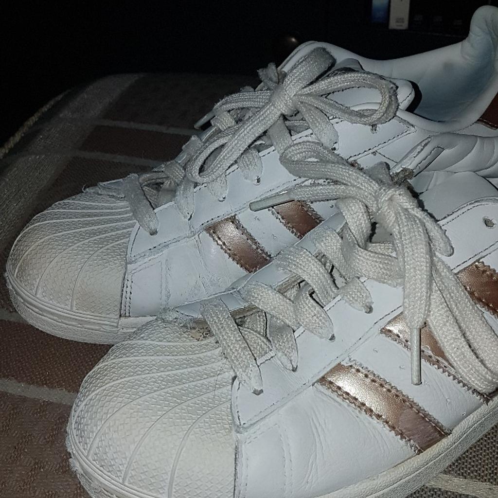 Adidas Superstar White & Gold mens Shoes Size UK 9. Used condition. See photos. These trainers are well used but with lots of life left in them. See photos for condition and I offer try before you buy option but if viewing on an auction site viewing STRICTLY prior to end of auction. Cash on collection or post at extra cost which is £4.55 Royal Mail 2nd class signed for. I can offer free local delivery within five miles of my postcode which is LS104NF. Listed on five other sites so it may end abruptly. Don't be disappointed. Any questions please ask and I will answer asap.