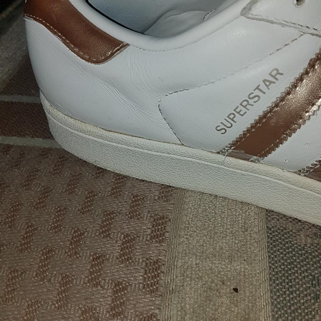 Adidas Superstar White & Gold mens Shoes Size UK 9. Used condition. See photos. These trainers are well used but with lots of life left in them. See photos for condition and I offer try before you buy option but if viewing on an auction site viewing STRICTLY prior to end of auction. Cash on collection or post at extra cost which is £4.55 Royal Mail 2nd class signed for. I can offer free local delivery within five miles of my postcode which is LS104NF. Listed on five other sites so it may end abruptly. Don't be disappointed. Any questions please ask and I will answer asap.