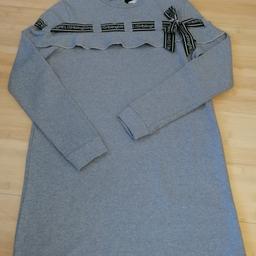 Beautiful designer sweatshirt dress worn once - excellent condition.

Label size is age 16 but very small sizes. Would fit more 10 to 14 year old depending on individual child.