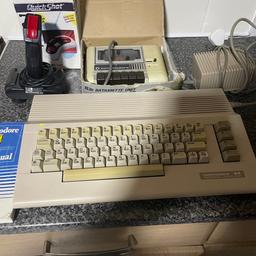 Commodore 64 with power supply 2 joysticks Ariel lead cassette deck 
70 games boxed another 40 in a bag no cases 
Fully working bargain price