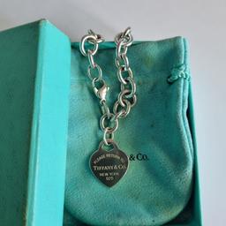 In good preloved condition Tiffany&Co. Tiffany RTT medium heart tag bracelet. Pouch and box. 7.5" length - end to end. Trusted seller, UK based (retails for £480). See my profile for a large variety of T&Co. items. Thank you.