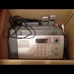 Fax machine with two phone handsets. Comes with a spare ink cartridge. Only used once. Very good condition.