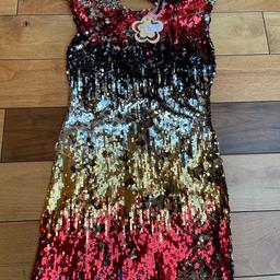 Brand new with tags party dress ideal for Xmas or wedding etc or can b given as present. Size s/M .
