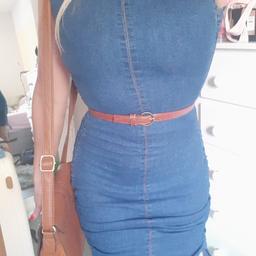 new pretty little thing size 8 denim dress.
ruched sides so can have dress as short or long as you want
belt not included