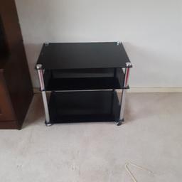 Black glass tables x 3 on casters for easy moveing around all in excellent condition comes from a smoke and pet free home collection only