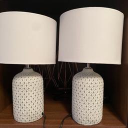 Two beautiful table lamps, white with grey flecks on base.