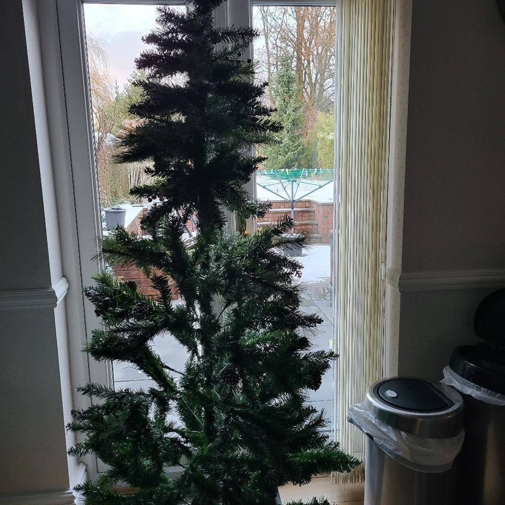 brand new tree, lifted from box to take photos , needs to be spread out more cone and berries attached