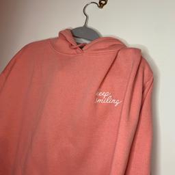 Primark keep smiling hoodie does have 2 pen dots on the sleeve like pictured.