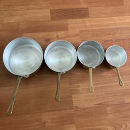 A Very Good Quality French Copper Four Piece Saucepan Set. Stainless Lined With Brass Handles.

Measurements for pans are as follows:

16.5cm Diameter x 8cm Deep

14.5cm Diameter x 7cm Deep

12.5cm Diameter x 6cm Deep

10cm Diameter x 5cm Deep