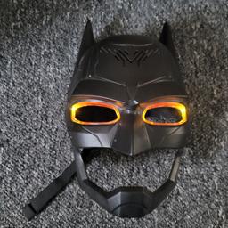 batman mask lights up and makes sounds also mimics voice great condition son never had no interest for it.