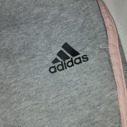 ADIDAS GIRLS LEGGINGS PANTS JUNIOR STRIPE JOGGERS JOGGING BOTTOMS AGE 11 to 12. Grey with pink. See photos for condition and size. I can offer try before you buy option but if viewing on an auction site viewing STRICTLY prior to end of auction.  If you bid and win it's yours. Cash on collection or post at extra cost which is £3.55 Royal Mail 2nd class signed for. I can offer free local delivery within five miles of my postcode which is LS104NF. Listed on five other sites so it may end abruptly. Don't be disappointed. Any questions please ask and I will answer asap.