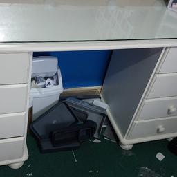 White dressing table with 8 draws also comes with glass topper. 
Only table and glass topper. 
Size 139 x 41 x 75 cm