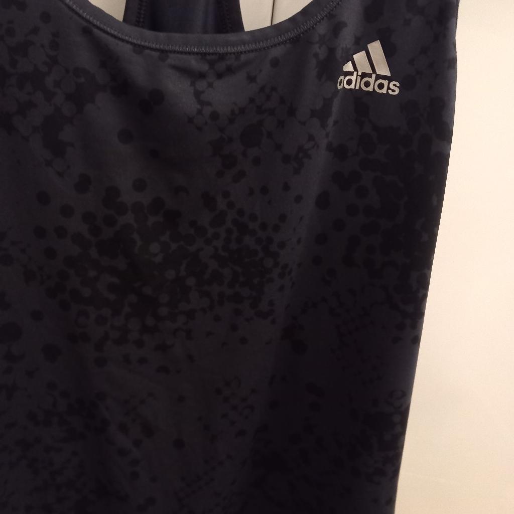 as you can see Adidas sport top fir women in small size (8-10)