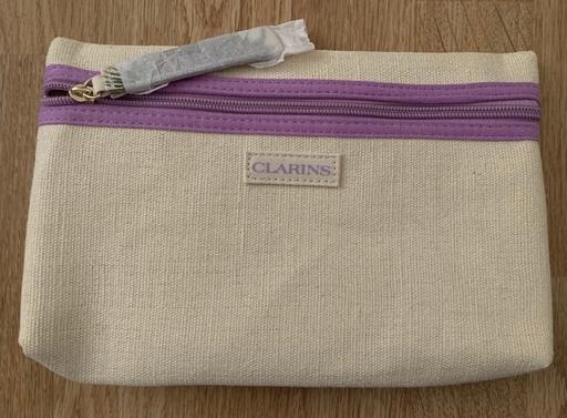 Buy & Sell Surrey Guildford - Photos for Brand New Cream Clarins Wash Bag