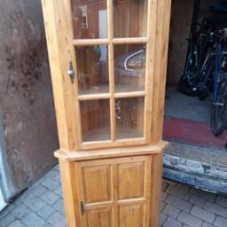 A nice vintage pine corner display unit measuring 73 inches high by 29 inches wide by 15 inches deep with 3 display shelves and storage cupboard. Can deliver for fuel costs 07786--012316 Sarah
