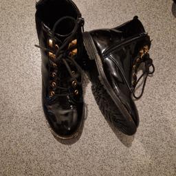 black patent leather river island boots with laces and gold detail, wear to them but still plenty use in them