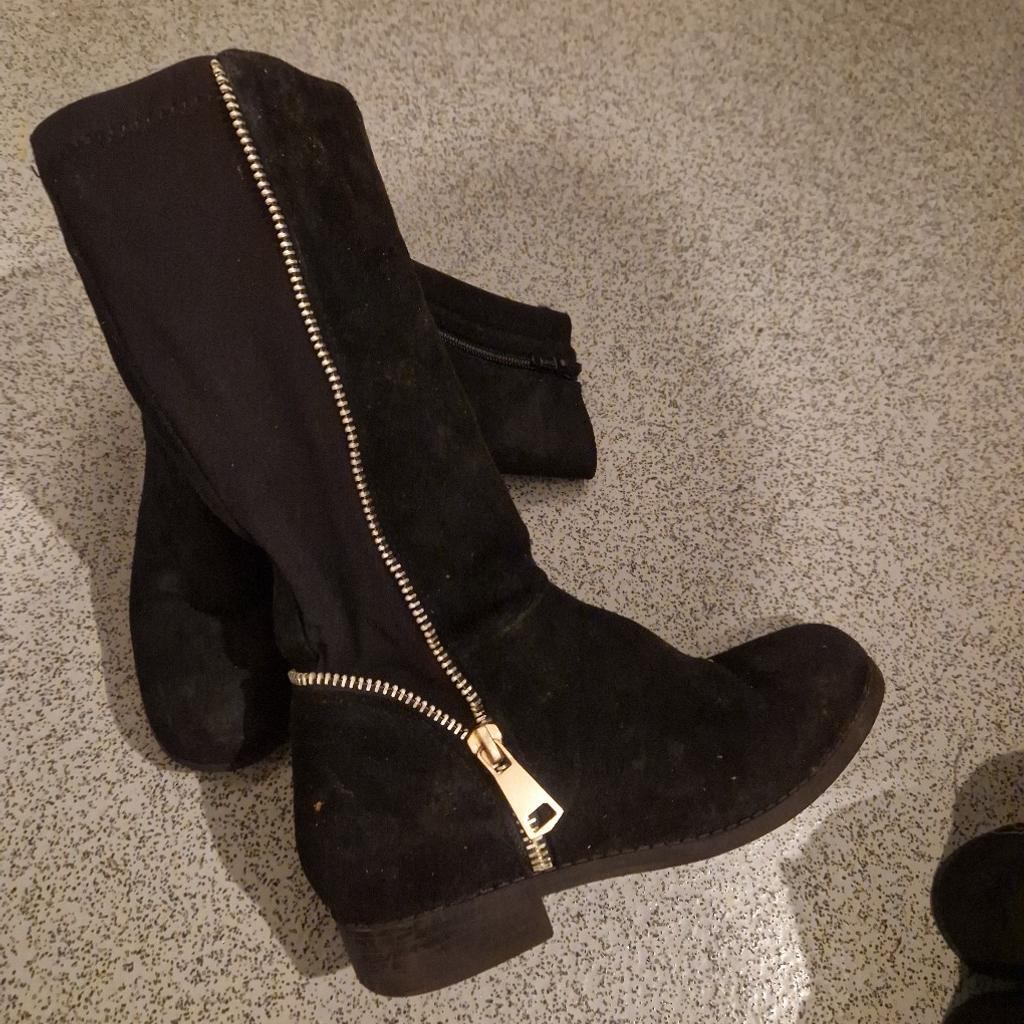 black suede calf boots with stretchy material to the back, inside zip fastening and gold zip detail to the outside