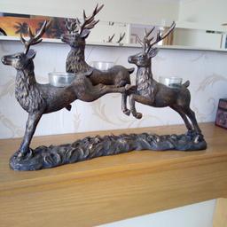 Lovely Christmas ornament or anytime even. 3 stags with tea light holders. Quite heavy and in perfect condition