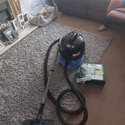 this hoover is working order yet needs a replacement wheel. hoover bags and attachments included.
