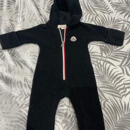 Genuine Moncler 
Age 3-6 months 
Slight mark on back in last picture 
Worn twice 
Paid £200 from flannels