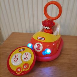 Very simple toddlers first remote control car. Large buttons on remote. Car makes noises, music and lights flash.