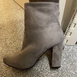 Grey healed boots never worn.

Pet and smoke free home