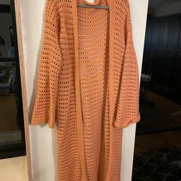 This item has been handmade by me but it came up large on me (14). It’s very long length. I am 5’5” and it comes to my ankles. Very warm.