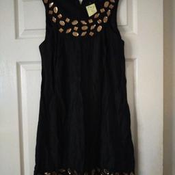 A lovely black dress.nice for a evening out.has nice gold colour beads.size 10. would need cleaning due to storage collection only.tipton.Dy49LN.