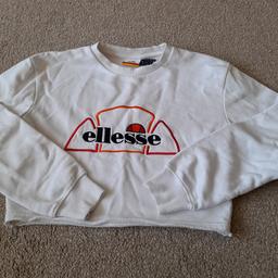 Ellesse Cropped Sweatshirt Size 6. Relaxed fit so will fit size 8 too. Used, some bobbling ftom normal wear and tear but otherwise good. White with colourful logo on front, round neck and long sleeved. From smoke and pet free home. Check out my other items. Happy to combine postage for multiple purchases or collection from DL5. Thanks for looking.