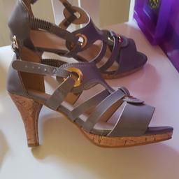 Ladies size 7 shoes only worn once.  colour as in picture olive/grey