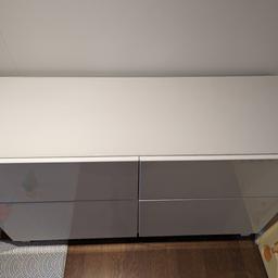 Ikea Besta Sideboard / living room cabinet, with two drawers and glass top.

It's white. Has two soft-close drawers at the top, and cupboard doors at the bottom. The left door is glued closed, because the hinger are broken. The right cupboard door is soft-clore and works fine.

It is 120x41.5cm, and 74cm high. It's in good condition, apart from the left cupboard door.

There's also a TV stand. See my other ad.

Cash on collection from Kingston, KT2 5FF. You will need a large car to pick it up