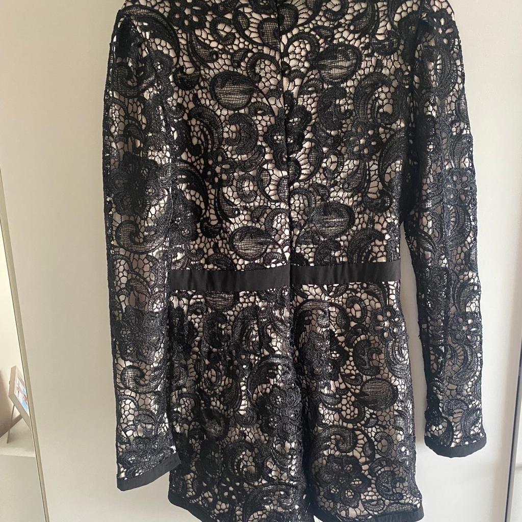 Long sleeve lace playsuit from MissGuided zips down at the back size 12
Only worn and washed once basically brand new