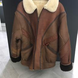 A luxurious unisex sheepskin jacket/coat from Tilmant Sheepskins of Australia. Double faced Suede from G.L. Bowron & Co Ltd. In New Zealand. And attractive design with stylish features. Luxury sheepskin inner lining with unique styling. Excellent condition almost as new. Originally cost many times more. Size 13/14.