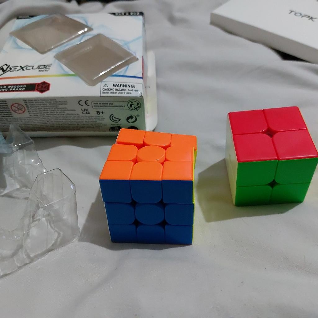 Mo Yu Nexcube 3D puzzles , selling a set of 3x3 and 2 x 2 with show stand .used but in excellent condition.