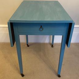 Victorian Drop Leaf Wooden Table / Desk + Drawer Blue Painted Brass Metalwork

Stunning Victorian drop leaf wooden table / desk with drawer and brass metalwork

Hand painted in baby blue

Measures approximately 71cm high x 71 cm deep x 50 cm with both sides down (or 71cm with one side up or 91cm with both sides up)

In wonderful condition for its age and beautiful details such as the hinges for wooden flaps with hold up the sides of the table and lovely rolling brass feet

Collection from Kilburn, NW6 (close to Queen’s Park and West Hampstead), Whitehall Park, N19 (close to Highgate, Archway and Crouch End) or Osterley/Isleworth on select days

Having a big clear out so please take a look at my other listings