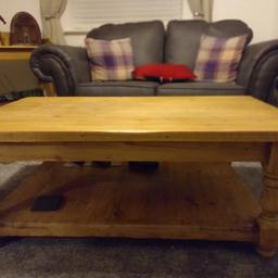 large pine reproduction coffee table ,2 tier .very heavy and solid . Lovely piece to add to any room in the home . last forever .