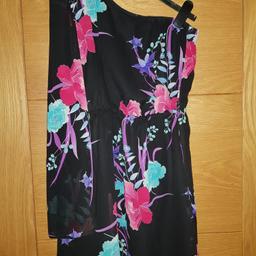Gorgeous River Island layered black cold shoulder dress with pink, purple and green floral print. Size 12 and knee length. Worn a couple of times for special occasions, label cut out, but well looked after and in clean, excellent condition. As well as free collection from us, we also offer UK postal delivery for £3.19.